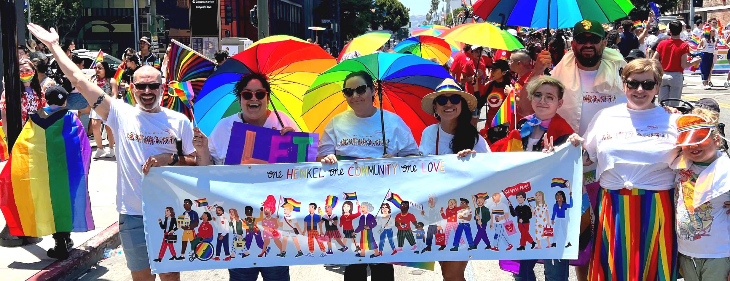 People marching in parade with banner