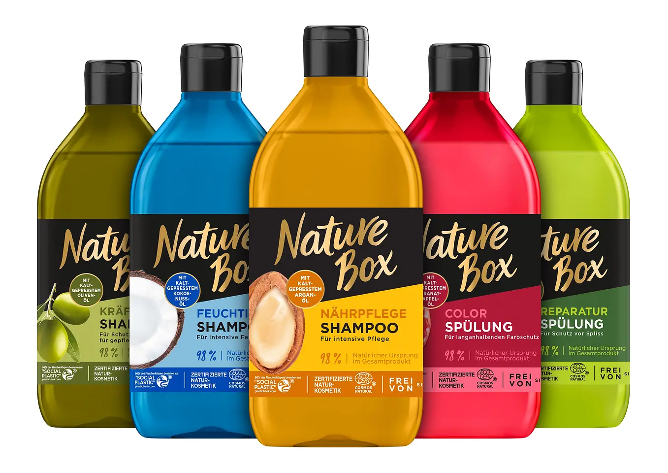 Fünf bunte Flaschen von Nature Box stehen nebeneinander.