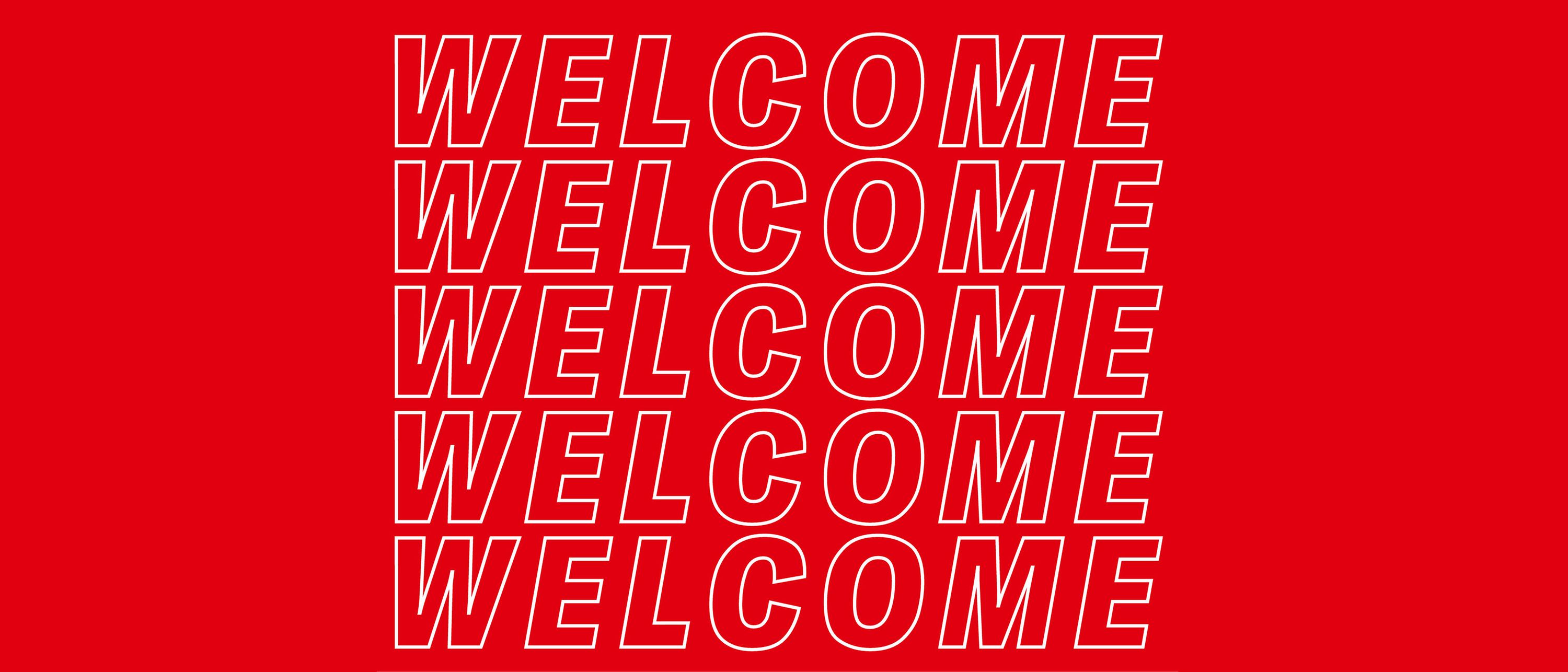 “Welcome” in weißen Buchstaben auf rotem Hintergrund. 