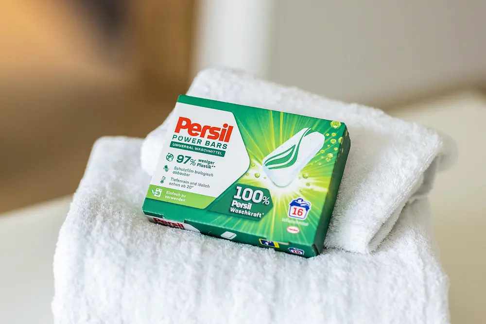 The packaged Persil Power Bars lie on towels.