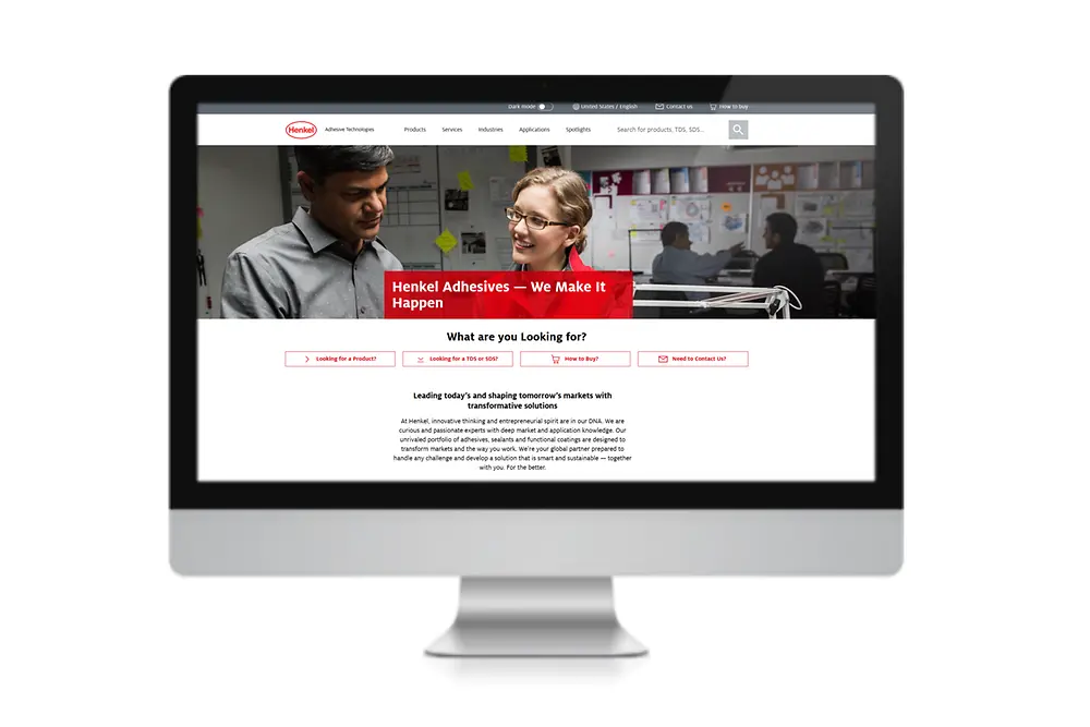 Monitor screen with the Henkel Adhesive Technologies website.