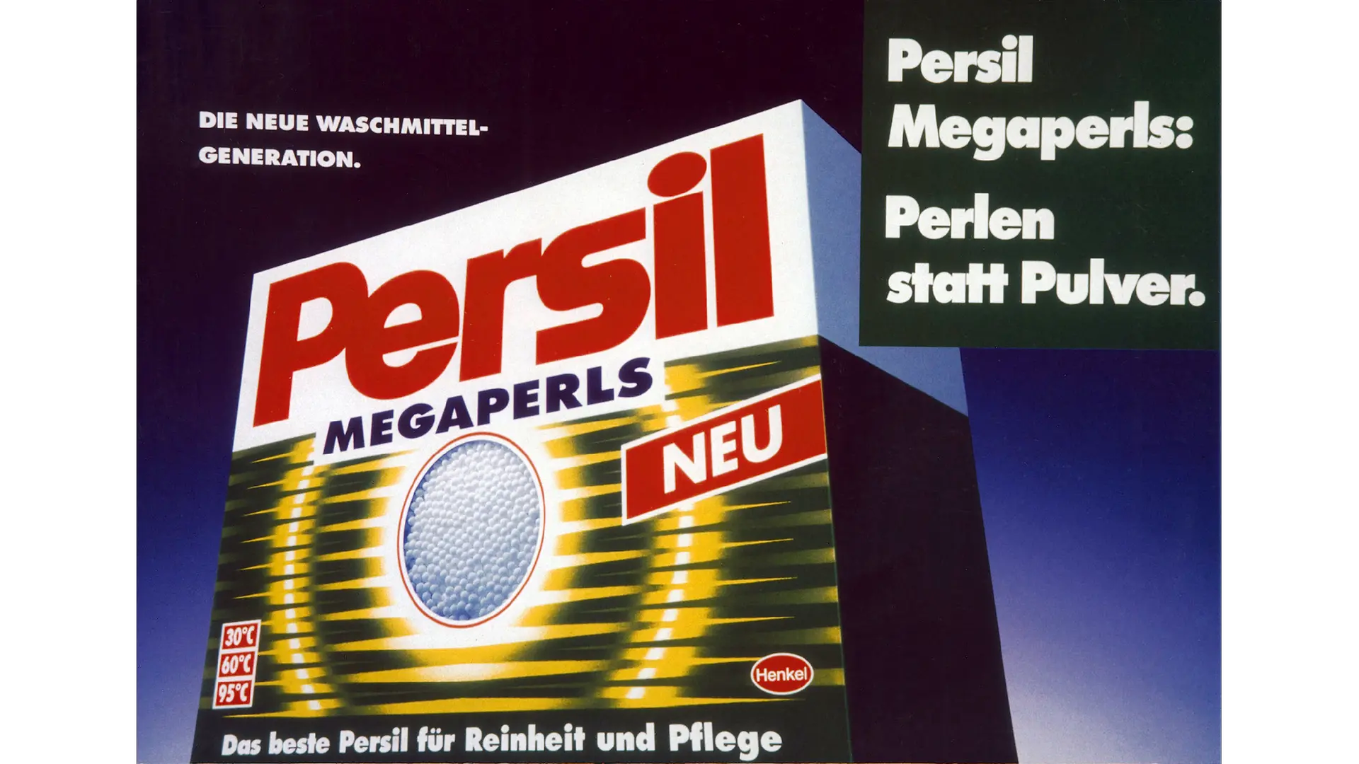 Eine Werbenanzeige für Persil Megaperls: Die weiß-grüne kantige Pappverpackung des Produkts leicht angeschrägt in der Bildmitte. Links oben verkündet ein kleinerer Text: „Die neue Waschmitel-Generation“. Aum rechten Bildrand steht in großen Buchstaben: „Persil Megaperls: Perlen statt Pulver“.