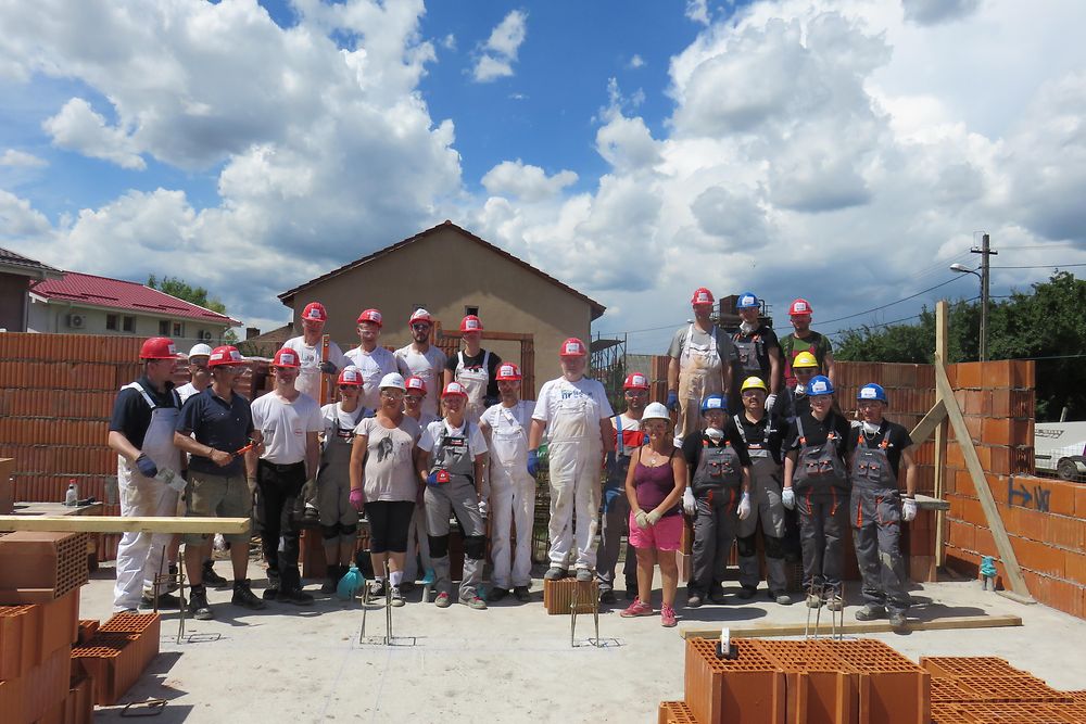 volunteers at a construction site in Romania